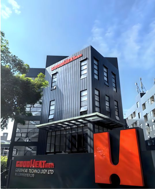 Exterior of the GOODHEAT company building with branded signage and an orange entrance feature